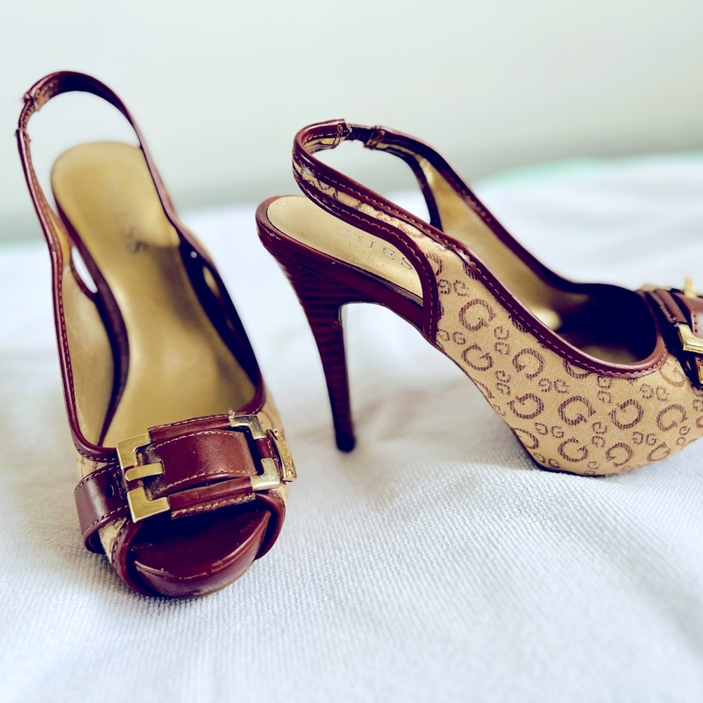 Guess heels size 5 1/2M. A few marks on the sole
